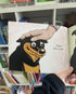 Mack Loves Cow Poo! kids book page with Mack getting a pat from a hand Adventure Awaits