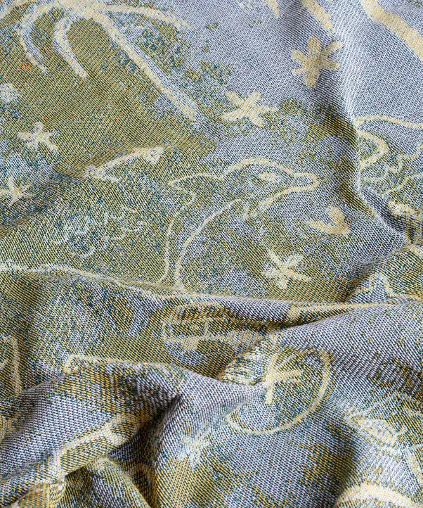 Green woven backing of Australia map picnic rug with travel icons and soft texture Adventure Awaits