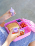 Silicone sauce bottle with lunch box containing food
