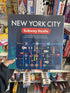 Hand holding New York City Subway Hustle board game in shop games aisle — Adventure Awaits