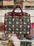Floral roll up travel organiser bag with burgundy handles, tie closure and vintage inspired print