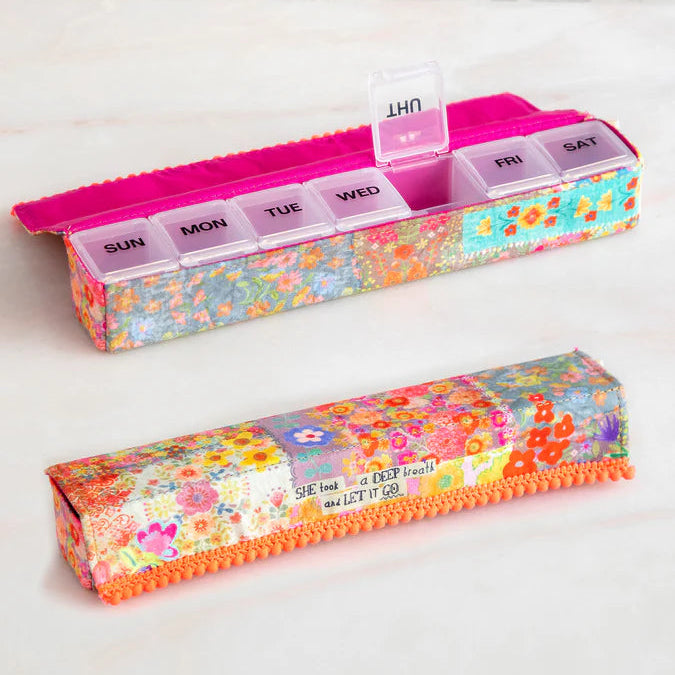 Nature life weekly pill organiser in deep breath showing the case closed and open with a compartment lid open