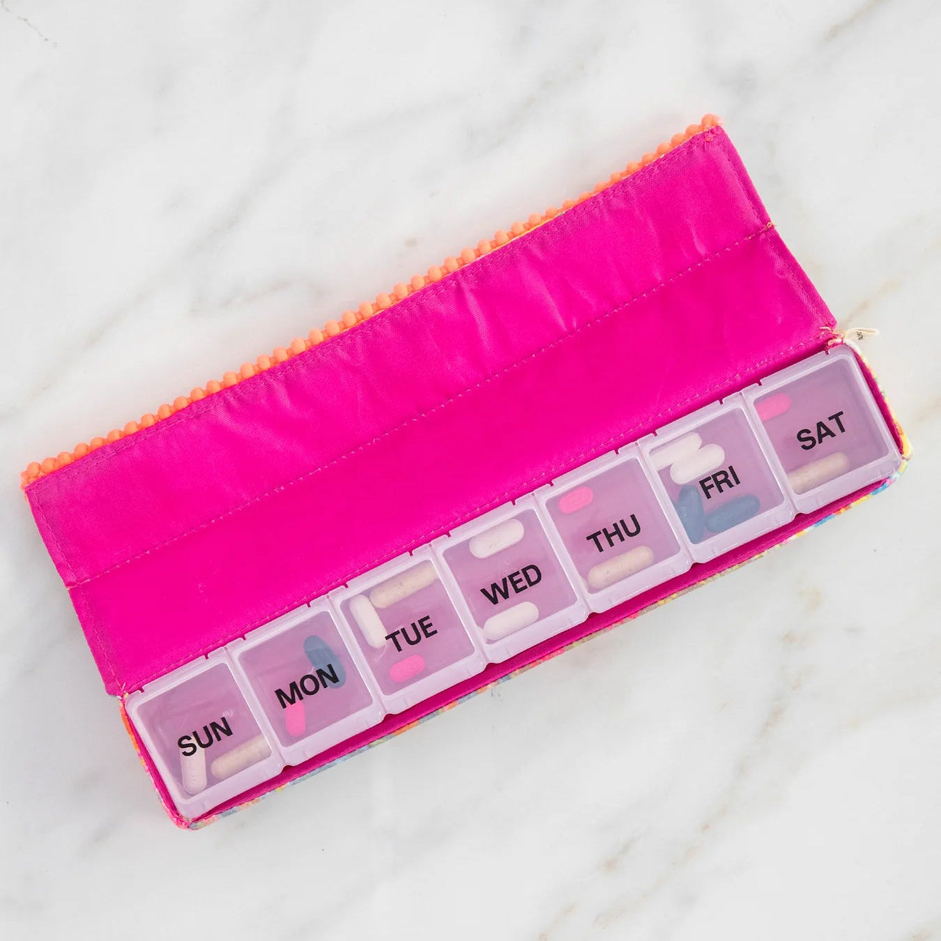 Nature life weekly pill pouch showing the inside of the pill box with pills in each day