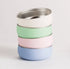 Stack of pastel baby bowls with stainless steel interiors — Adventure Awaits