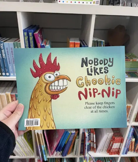 Nobody Likes Chookie Nip-Nip back cover with grinning chook and chicken warning Adventure Awaits