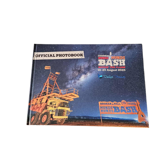 Official photobook with a truck and event details on the cover