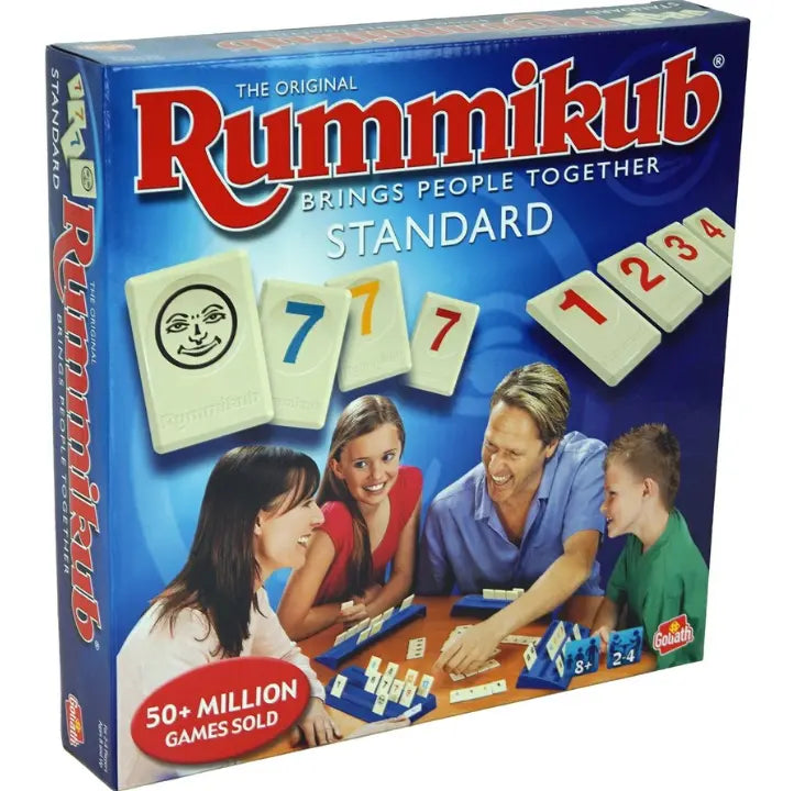 Adventure Awaits Rummikub Standard family board game box featuring numbered tiles and multiplayer gameplay