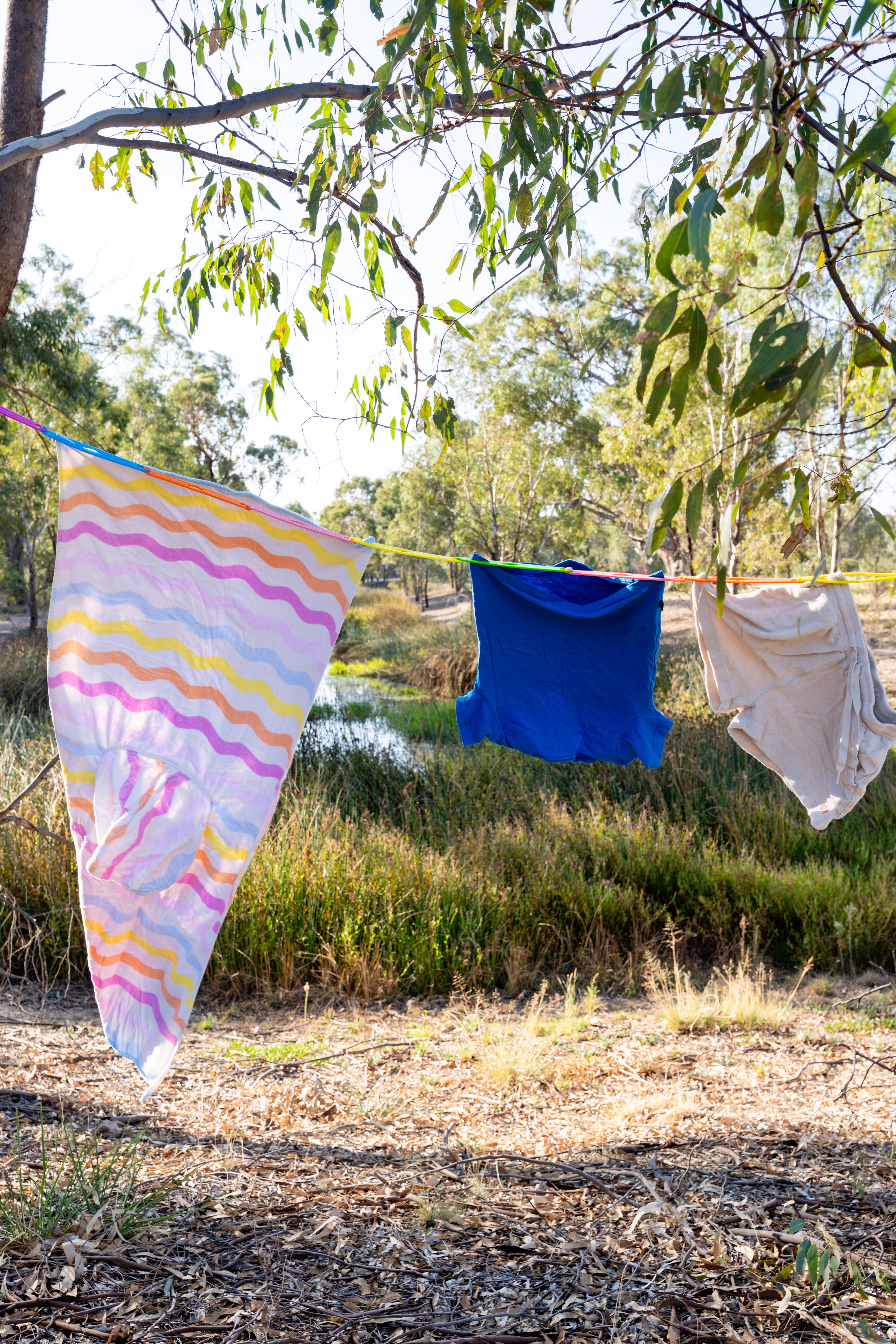Slide n' Dry Pegless Clothesline | Ultimate Camping Clothesline Rainbow