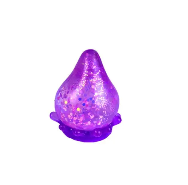 Purple glitter drop squishy toy with translucent sparkle finish on white background — Adventure Awaits