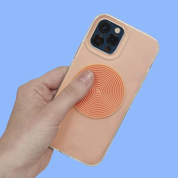 Hand holding a phone with a spiral speks slab sticker on a blue background
