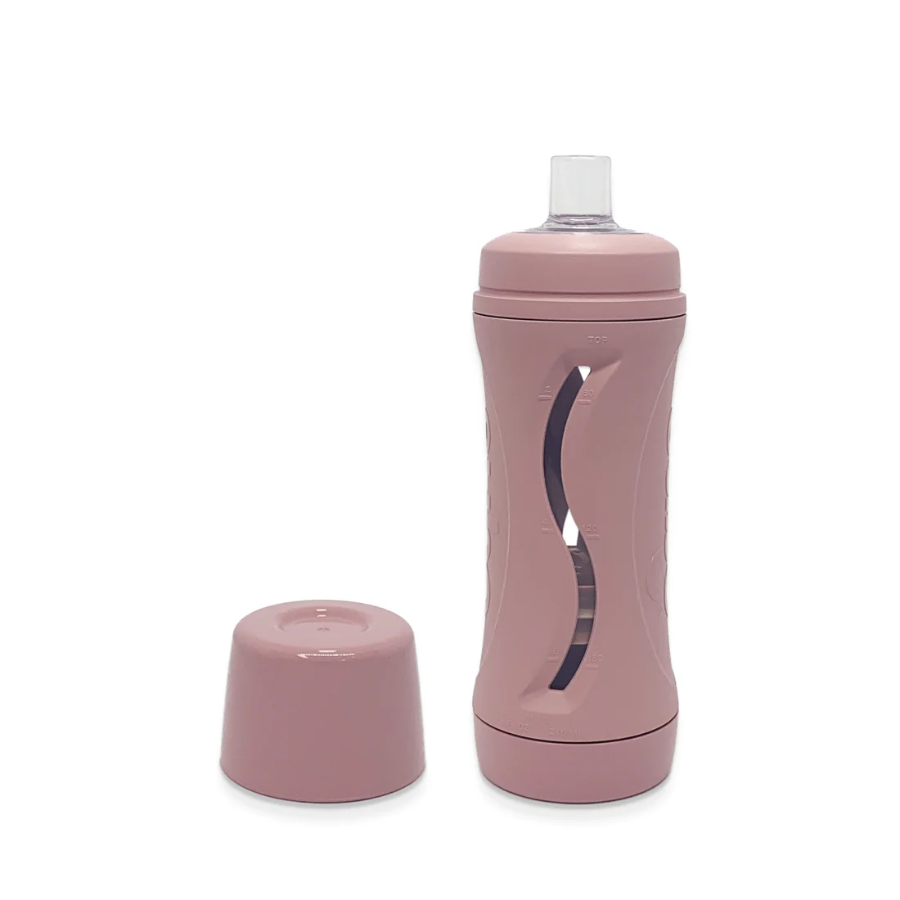 blush subo the food bottle shown with lid removed and sitting beside the bottle on a white background