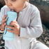 toddler using subo food bottle ourdoors