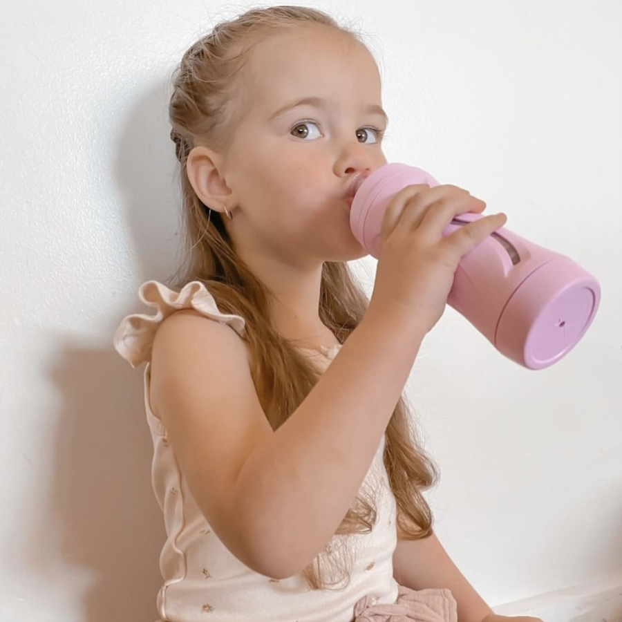 older child using subo food bottle
