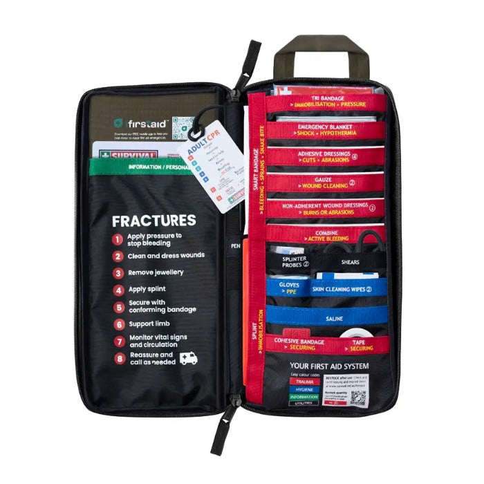 Khaki Survival First Aid kit opened with colour-coded supplies and fracture guide — Adventure Awaits