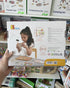 Hand holding back of VIGA Tack Zap Farm box with child using hammer and activity cards — Adventure Awaits