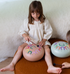 Tambu+ Large steel tongue drum with girl