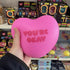 Pink The Big Squij heart squishy with You’re Okay message held in store Adventure Awaits