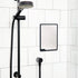 Charcoal shower mirror mounted on white tiles beside black shower head — Adventure Awaits