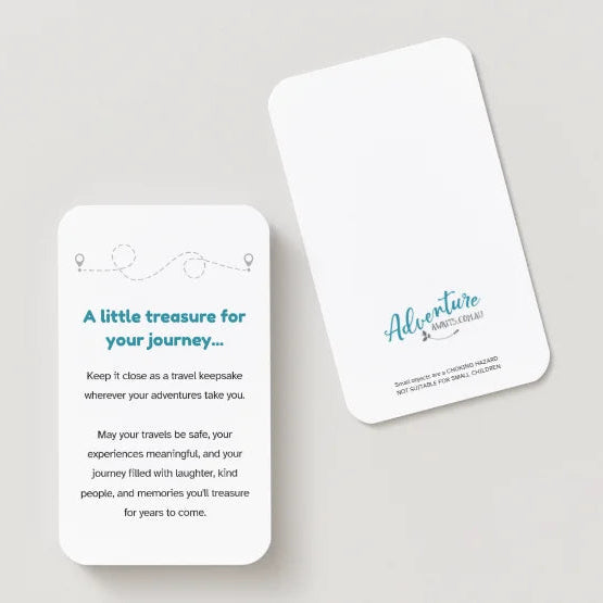Travel keepsake card front and back, showing the journey message and matte reverse with Adventure Awaits logo — Adventure Awaits