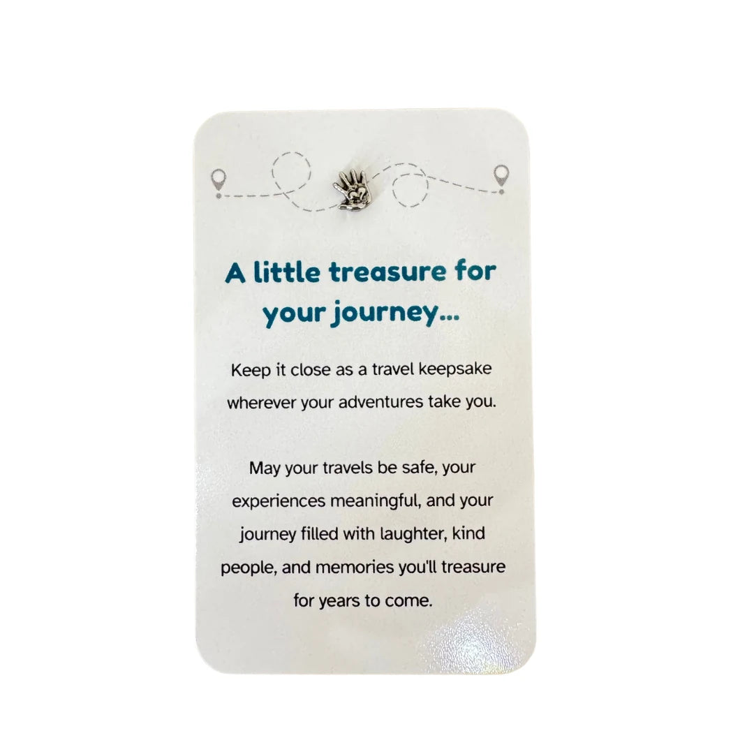 Travel keepsake card with silver hand on heart charm and journey message — Adventure Awaits