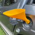 Yellow fuel funnel fitted to a car diesel filler for easier refuelling — Adventure Awaits