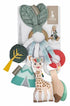 Sophie La Giraffe baby sensory toy set on a white background, featuring a green leaf-shaped rattle, a giraffe plush, a tree toy, and other colorful accessories attached to a printed backing card.