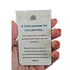 Caravan keepsake card held in hand showing teal and mustard enamel caravan charm and journey message — Adventure Awaits