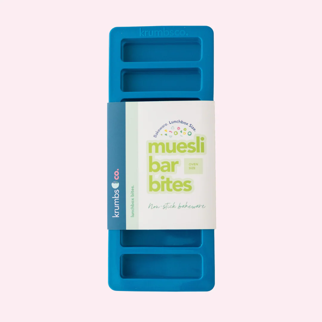 Blue muesli bar bites packaging with a white label on a light purple background
