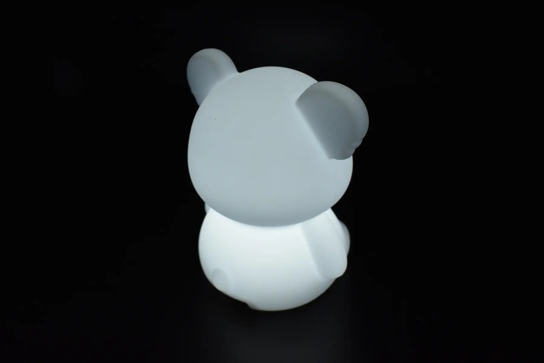Rear view of Koala Dream Bedtime Buddy soft silicone koala night light glowing white — Adventure Awaits