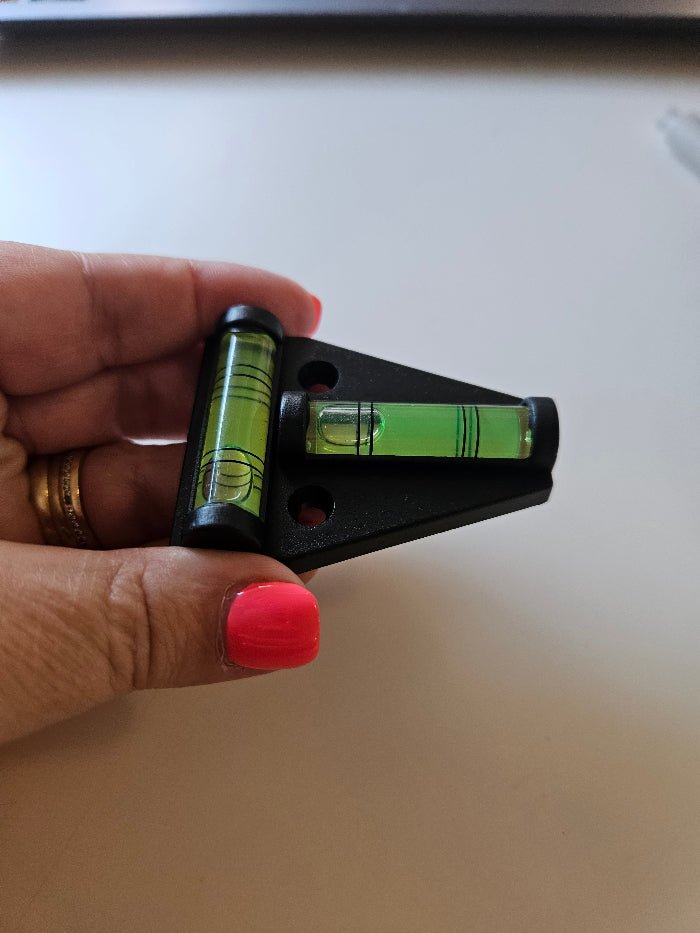 black t level in hand to show dimensions