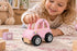 Child playing with Koala Dream pink Blossom Car wooden push vehicle on a playroom rug — Adventure Awaits