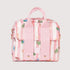 Pink handbag with floral pattern on a light gray background
