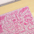 Close-up of the completed pink Penis Puzzle showing cheeky illustrated jigsaw details — Adventure Awaits