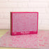 Pink Penis Puzzle box displayed in front of the completed 1000-piece illustrated jigsaw — Adventure Awaits