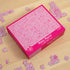 Pink Penis Puzzle box with 1000-piece jigsaw design surrounded by matching puzzle pieces — Adventure Awaits