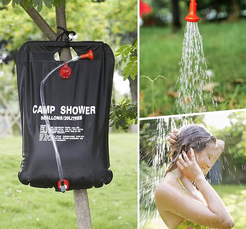 Portable camp shower with hose attached to a tree, showing water being used outdoors.