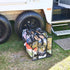 Campaq clear storage bag packed with clothes beside a caravan step at camp — Adventure Awaits