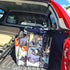 Clear Campaq storage bag packed with clothes in a ute tray for camping trips — Adventure Awaits