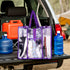 Purple Campaq clear storage bag packed with camp gear in a 4WD boot at a campsite — Adventure Awaits