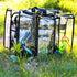 Campaq clear storage bag packed with pet and travel gear on grass at a campsite — Adventure Awaits