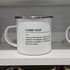 Mug with 'Camp Dad' definition on a shelf with decorative items.
