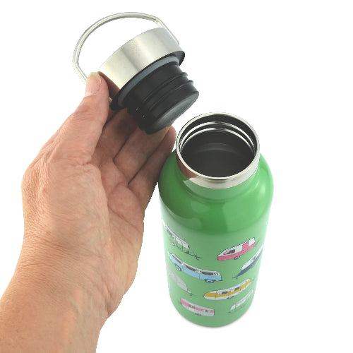 Green insulated bottle with colorful illustrations held by a hand against a white background