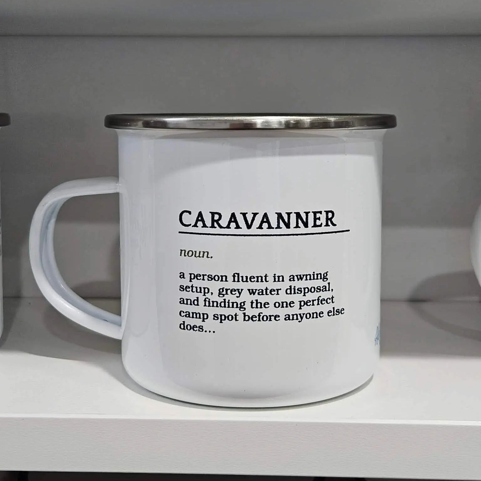 "Caravanner" definition enamel mug displayed in Adventure Awaits store — unique gift idea for Australian caravanners — Adventure Awaits