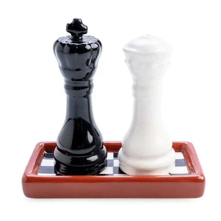 Black and white chess piece salt and pepper shakers on checkerboard tray — Adventure Awaits