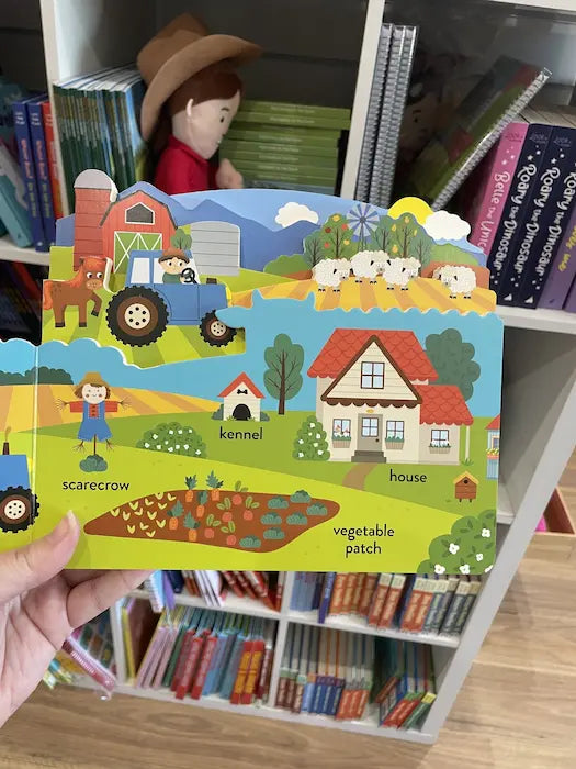 Adventure Awaits My First Words On The Farm board book open to illustrated farm vocabulary learning pages