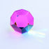 CMY Cubes Mundus pink dodecahedron casting soft rainbow light on a pale background — Adventure Awaits