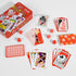 Coca-Cola playing cards and dice set laid out with red collectible tin — Adventure Awaits