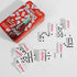 Coca-Cola dominoes game with red tin and white domino pieces laid out — Adventure Awaits