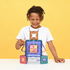 child building colourful Connetix magnetic tile structure, creative construction toy for imaginative play and learning at home or travel Adventure Awaits