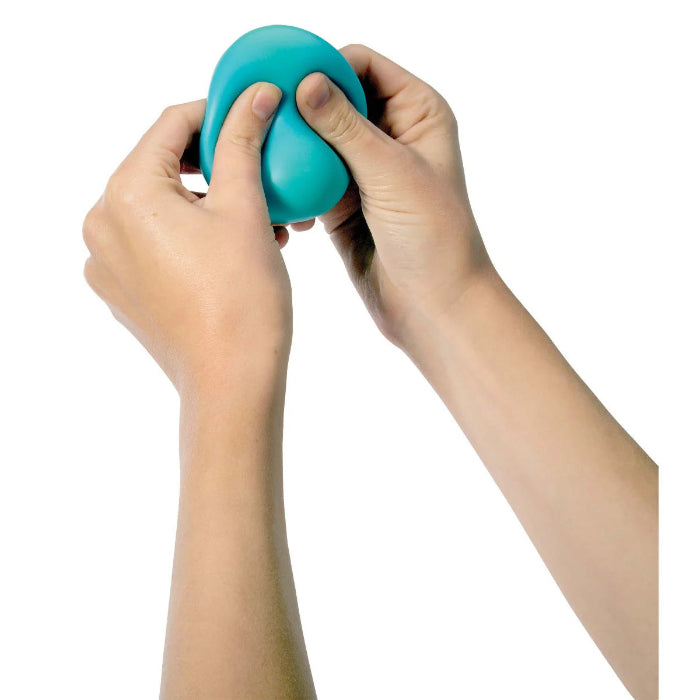 Hands squeezing blue Crush It! super sensory ball for tactile play — Adventure Awaits